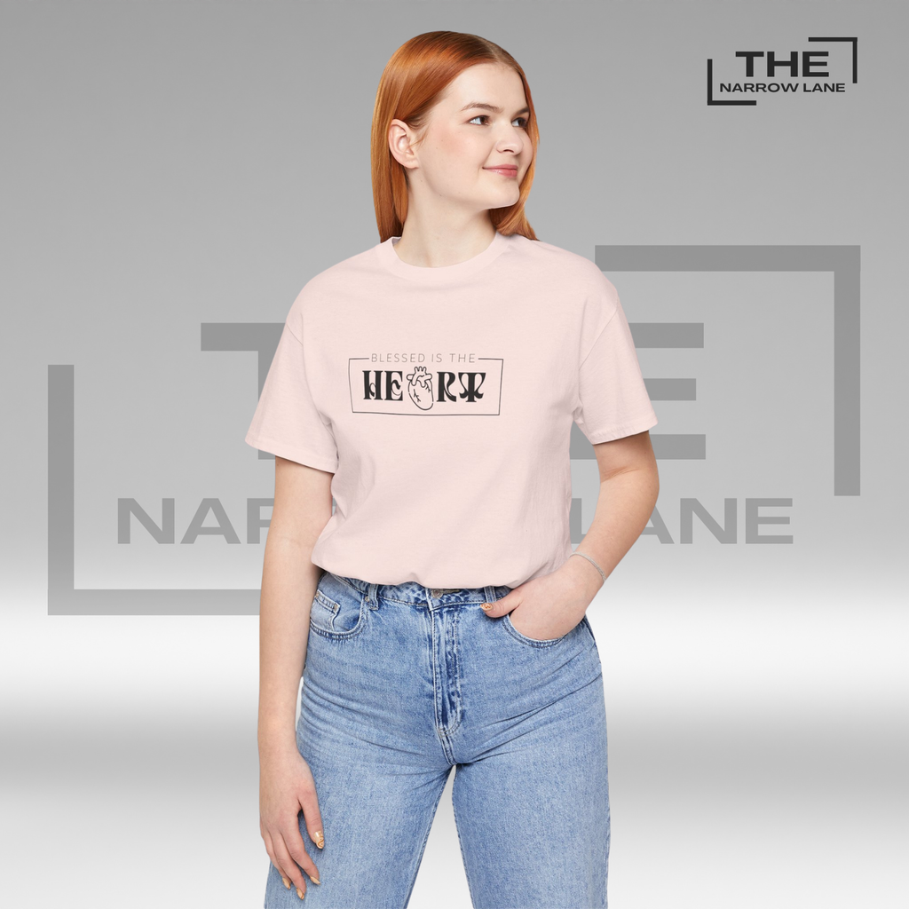 A woman wearing The Narrow Lane Pink Christian shirt "Blessed is the Heart" – faith-inspired gift for spiritual growth.